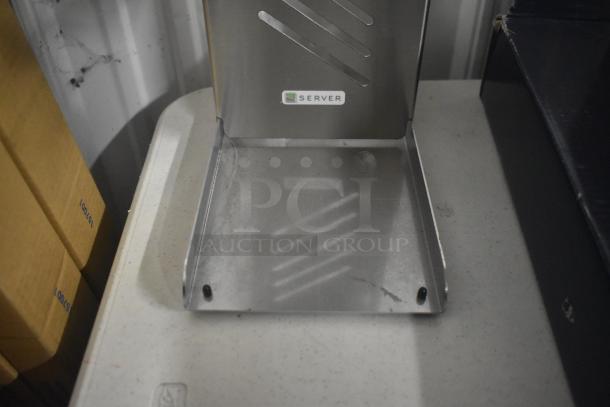 Stainless steel Server countertop dry dispenser, rectangular design, used condition. Visible "Server" label on front.