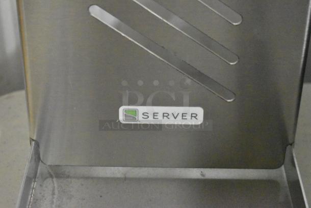 Stainless steel Server countertop dry dispenser, features sleek design and logo, ideal for efficient product dispensing.