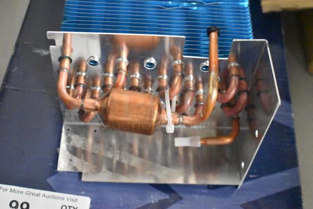 BRAND NEW Norpole 4R7K370L Evaporator Coil, scratch and dent condition, features copper tubing and aluminum fins.