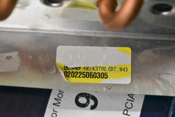 BRAND NEW SCRATCH AND DENT Norpole 4R7K370L Evaporator Coil with visible label showing model and serial number.