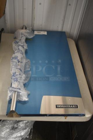Brand new Hoshizaki ice machine door; blue finish, wrapped stainless steel handle, minor scratches, model label visible.