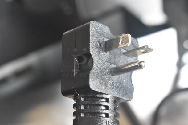 Close-up of power plug for Avantco 184T140 10" Conveyor Toaster, shows electrical prongs and details, minor surface imperfections.