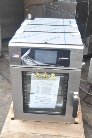Alto Shaam CTX4-10E stainless steel combi oven, new with protective films, visible control panel, labels, and warnings.