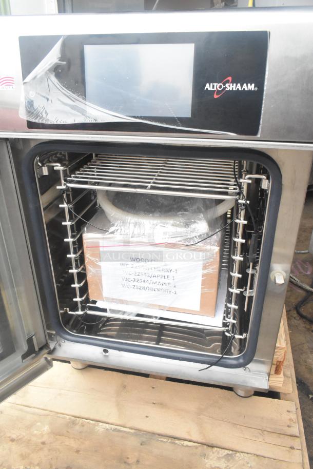 Stainless steel Alto Shaam CTX4-10E combi oven, boilerless, brand new, 380-415V, 3 phase, open door showing interior.