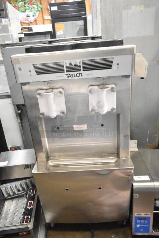 2021 Taylor 359-33 soft serve machine, two flavors, air-cooled, commercial casters, 208-230V, 3 phase, excellent condition.