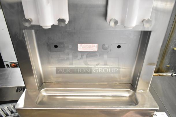 2021 Taylor 359-33 air-cooled soft serve machine, 2 flavors, commercial casters, 208-230V, 3 phase, stainless steel exterior.