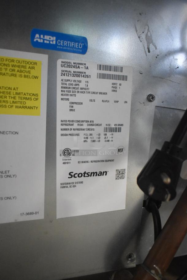2024 Scotsman UC2024SA-1A stainless steel ice machine info plate, 227 lb. capacity, AHRI certified, 115 volts.