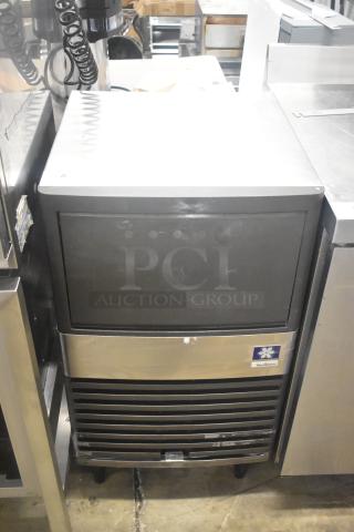 Manitowoc QM45A stainless steel undercounter ice machine, shows moderate use, 115V, 1 phase, front logo visible.