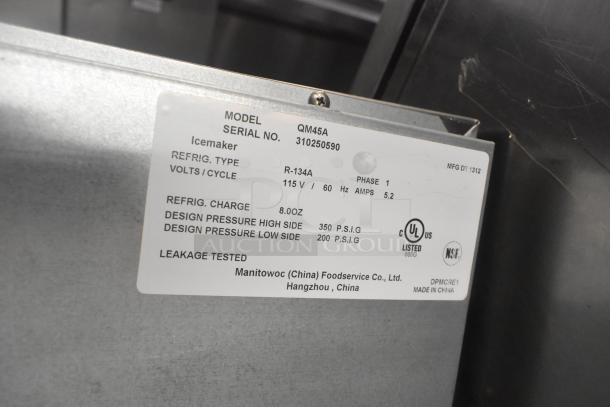 Manitowoc QM45A ice machine label showing model, serial number, specs, and certification markings.