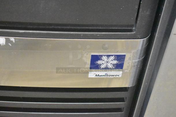 Manitowoc QM45A stainless steel ice machine, self-contained, undercounter model, 115 volts, 1 phase, visible Manitowoc logo.