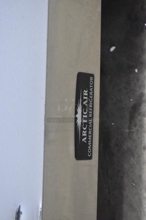 Arctic Air R22CWF6 single door reach-in cooler, with commercial casters, 115 volts, logo visible on stainless surface.