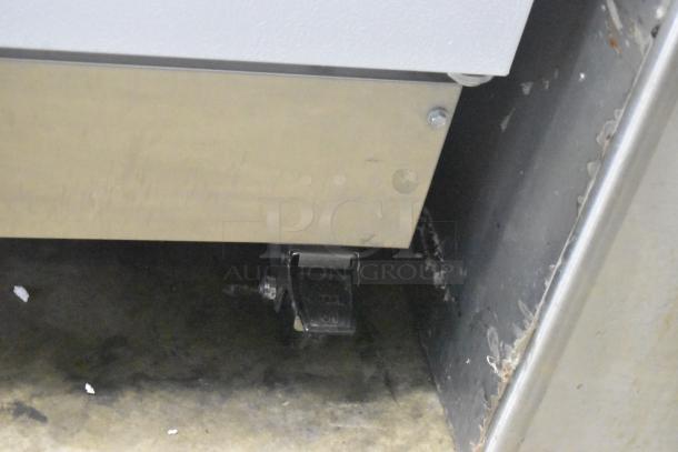 Arctic Air R22CWF6 single door cooler on caster; shows base and caster detail. 115 volts, 1 phase, commercial condition.