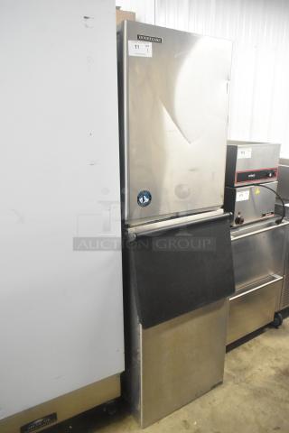Hoshizaki KM-501MWH stainless steel commercial ice machine head on bin, 115V, 1 phase, visible logo, and minor surface wear.