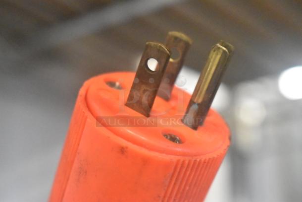 Close-up of a three-prong electrical plug with an orange casing, compatible with a Hoshizaki KM-501MWH ice machine.