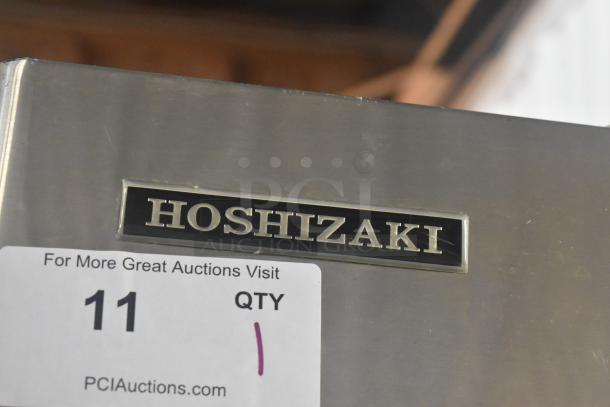 Hoshizaki KM-501MWH commercial ice machine head on bin, stainless steel, 115V, 1 phase, branded label visible.