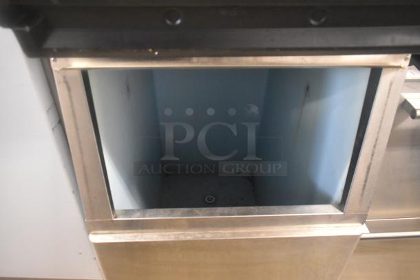 Hoshizaki KM-501MWH stainless steel ice machine head on a commercial bin, 115 volts, 1 phase, clean interior, sturdy build.