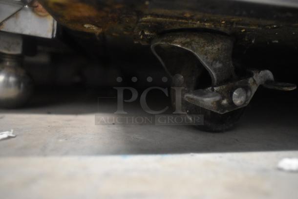 2019 Delfield 406P-STAR2 undercounter cooler on commercial casters, 115V, single door. Image shows a close-up of caster wheel.