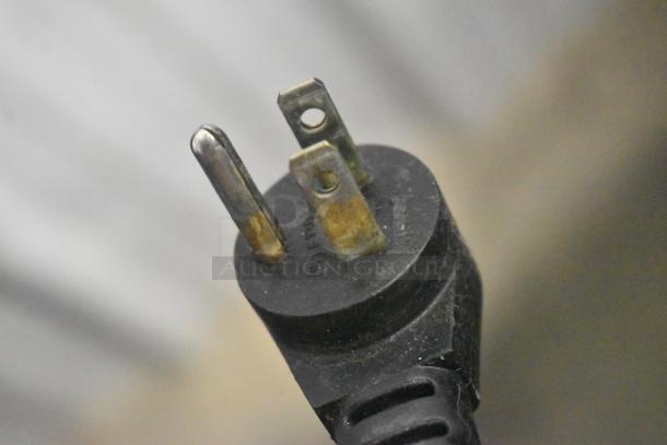 Close-up of a three-prong plug from a 2019 Delfield 406P-STAR2 cooler.
