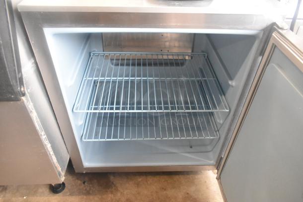 Delfield 406CA-DD1 undercounter cooler, single door, commercial casters, 115V, 1 phase, interior rack, clean condition.