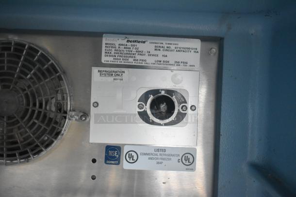 Delfield 406CA-DD1 undercounter cooler, commercial grade, single door, 115V, labels showing model and certification.
