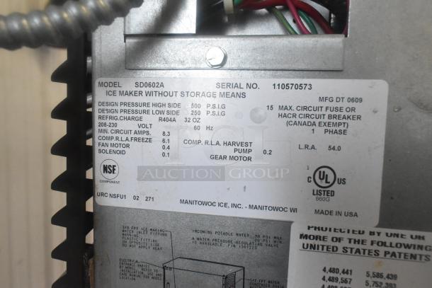 Manitowoc SD0602A ice maker label showing model, serial number, electrical specs, UL and NSF certifications.