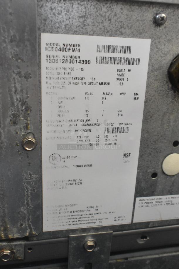 Stainless steel Ice-O-Matic ICE0400FW4 ice machine head on Ice-O-Matic B40PSB bin, 115V, 1 phase. Labels show model and specs.