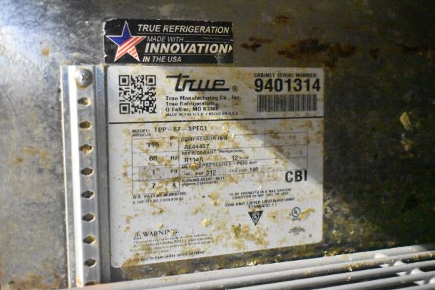 Label on 2019 True TPP-67 stainless steel pizza prep table. Includes model TPP-67, 115V, phase 1, refrigerant R134A.
