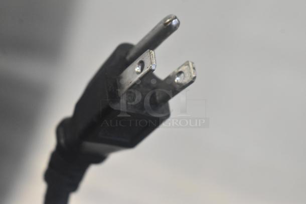 Close-up of a standard electrical plug for the Avantco 178SSPT48MHC prep table.