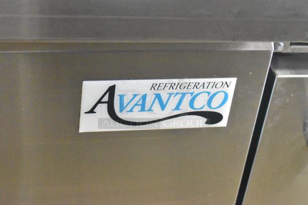 Avantco 178SSPT48MHC stainless steel sandwich salad prep table with logo, on commercial casters.