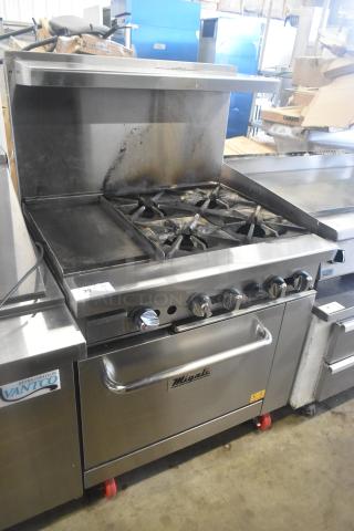 Migali C-RO4B-12GL-NG commercial range with 4 burners, griddle, oven, on casters; used condition, natural gas powered.