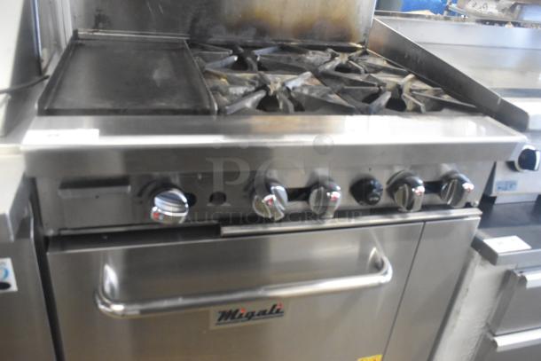 Migali C-RO4B-12GL-NG 4 burner range with griddle and oven, natural gas, on casters, stainless steel, used condition.