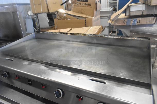 Garland GTGG60 commercial gas griddle, countertop model, stainless steel, flat top, greased edges, slightly used.