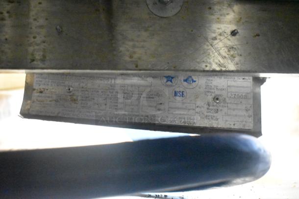 Garland GTGG60 commercial gas griddle, metal construction, visible identification tag with model and specifications.