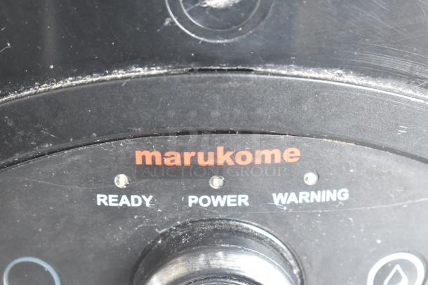 2016 Bunn LCA-1 Marukome countertop coffee dispenser panel with "READY," "POWER," and "WARNING" lights visible.