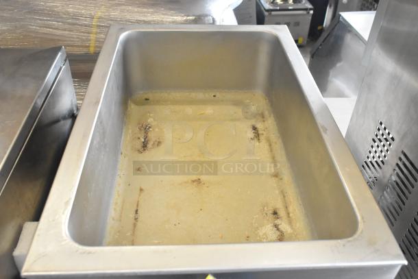 Adcraft FW-1500W/C countertop food warmer, stainless steel, used condition, 120 volts, interior shows signs of previous use.