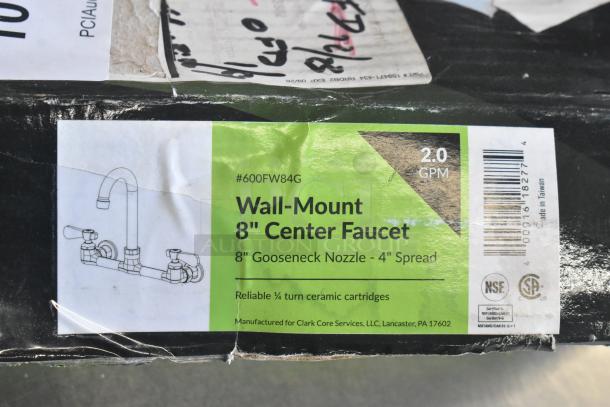 Brand new Regency 600FW84G wall mount faucet with 3 1/2" swivel gooseneck spout, 8" centers, minor scratches on packaging.