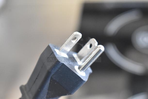 Close-up of a three-prong power plug for the Avantco 177ID18DB Double Induction Range, 208-240V, in excellent condition.