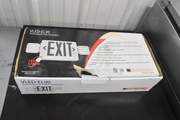 VLED-EL90 thermoplastic LED exit sign, brand new, slight box damage, features long-life LEDs, UL listed.