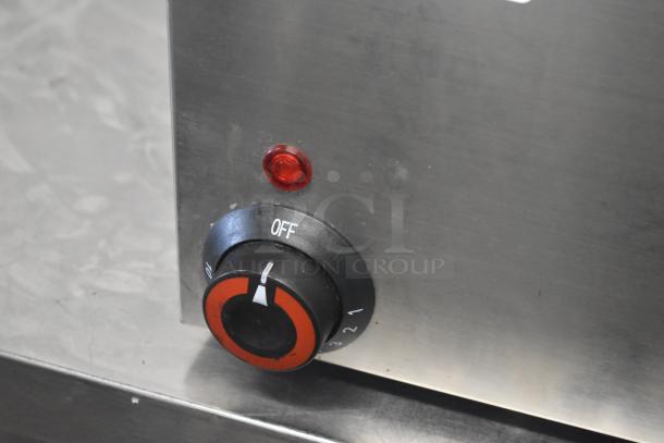 Adcraft FW-1500W/C food warmer control panel showing power dial and indicator light. Stainless steel finish.