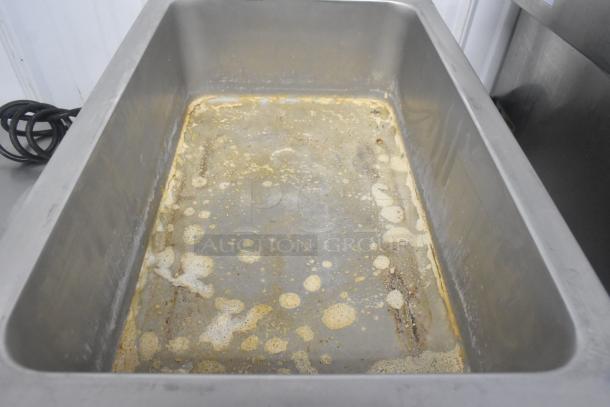 Adcraft FW-1500W/C commercial countertop food warmer in used condition, 120 volts, stainless steel, visible wear.