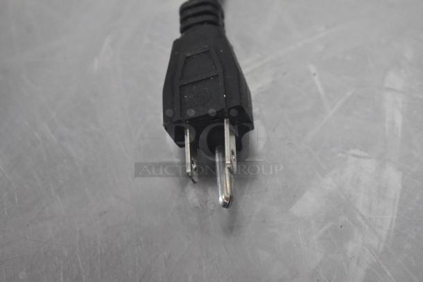 Close-up of a power plug for Adcraft FW-1500W/C Commercial Countertop Food Warmer, 120 volts, 1 phase, in good condition.