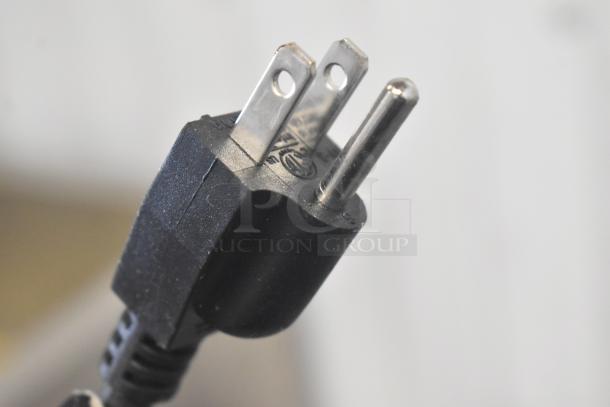 Power cord of Adcraft FW-S500 Commercial Food Warmer, 120 Volts, 1 Phase, showing a standard three-prong plug.
