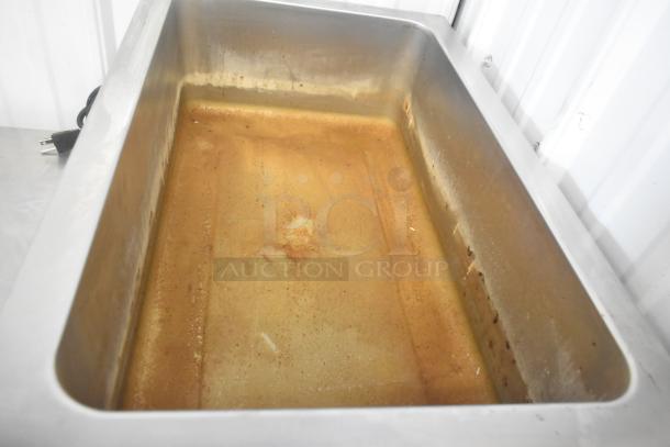 Winco FW-S500 Commercial Food Warmer, stainless steel, countertop model, 120V, used condition with visible interior wear.