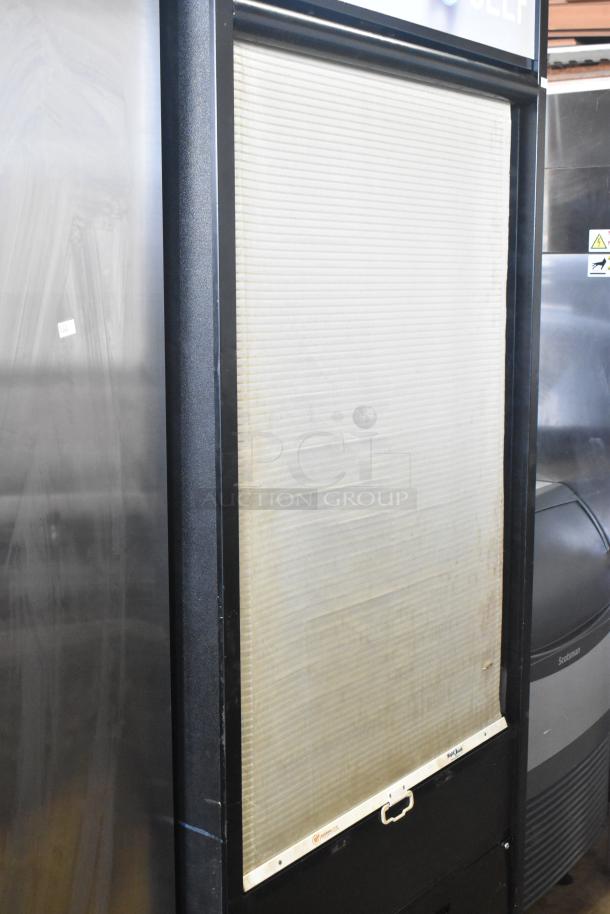 Structural Concepts Oasis B32EW commercial merchandiser, 120V, 1 phase, with visible roll-down cover, in used condition.