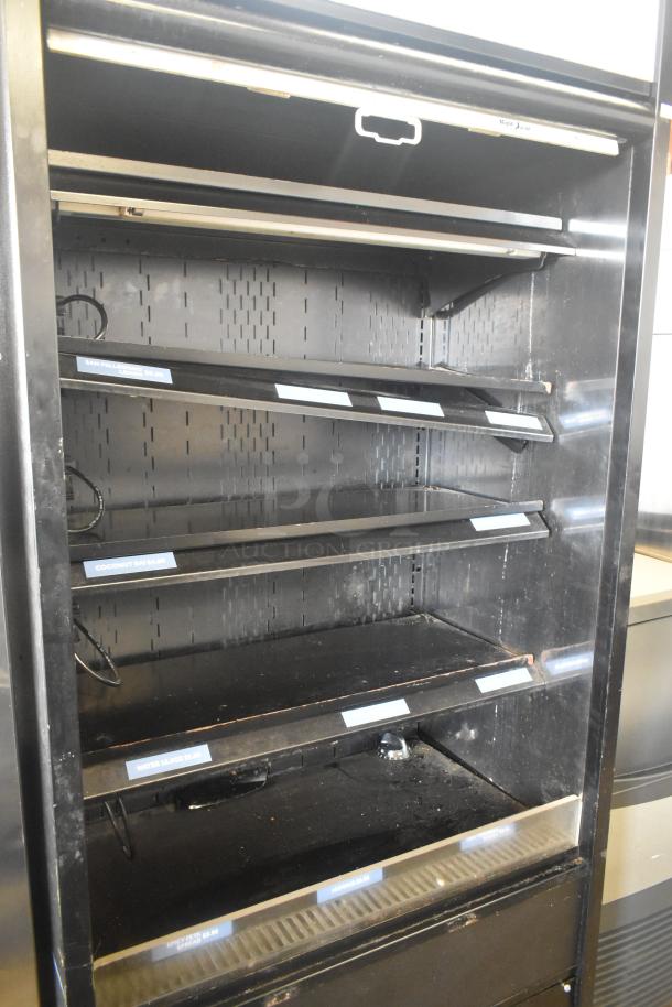 Structural Concepts Oasis B32EW open merchandiser, 120V, 1 Phase, used condition with multiple adjustable shelves and item labels.