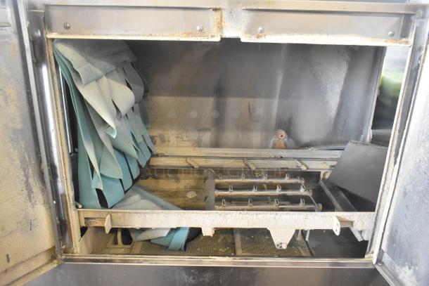 Champion Commercial Conveyor Dishwasher, 208V, 3-phase, used condition, visible interior components, needs cleaning.