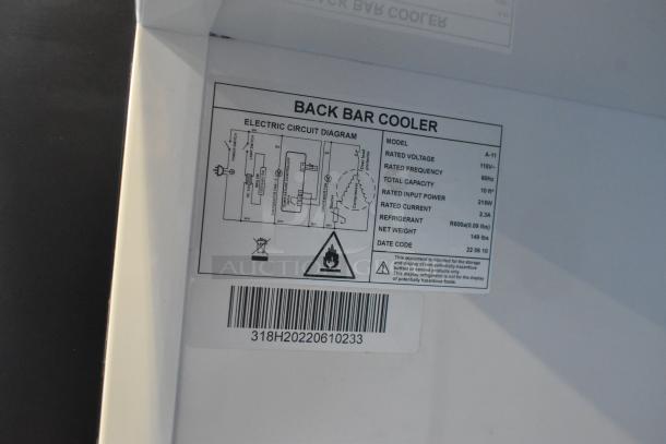 A-11 Commercial Single Door Reach In Cooler, model A-11, 115V, 1-phase, 10 ft³ capacity, R600a refrigerant. Label with specs.