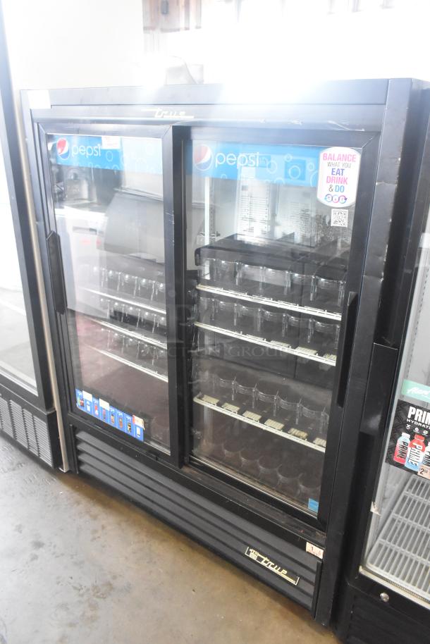 True GDM-41SL-60-LD cooler merchandiser, two-door, commercial, black frame, Pepsi branding, 115V, 1 phase, good condition.