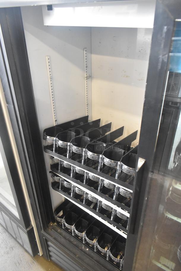 True GDM-41SL-60-LD commercial cooler, black interior shelving, glass doors, 115 volts, used condition.