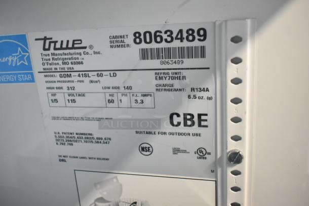 True GDM-41SL-60-LD cooler label showing model, serial number, 115 volts, refrigerant type, made in USA, and certifications.